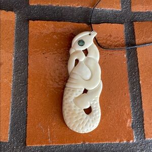 Manaia carved bone pendant charm necklace from New Zealand